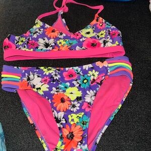 Justice 2 piece swimsuit. Bright pink& purple floral print. VGUC. 12.